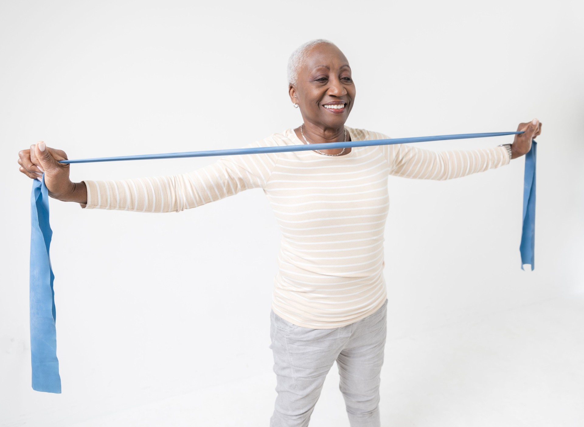 Senior Woman Using Resistance Rubber Band